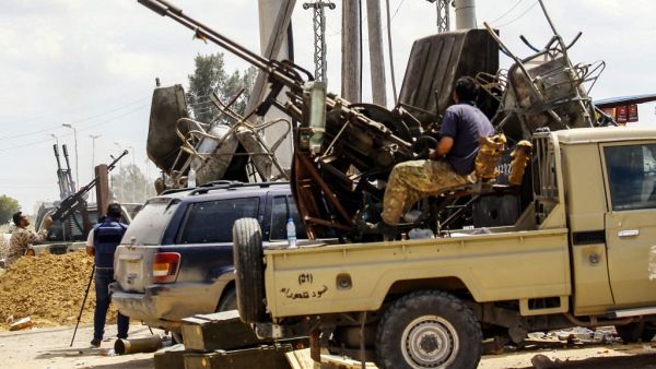 Fighters man turrets in technicals (pickup trucks mounted with turrets) stationed at a position held by forces loyal to Libya's Government of National Accord (GNA) in the suburb of Wadi Rabie. (AFP/ File Photo)
