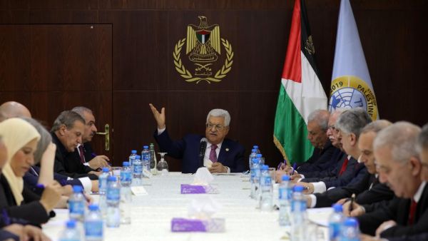 Palestinian President Mahmud Abbas (C) gestures during his meeting with the newly announced government in the Israeli-occupied West Bank town of Ramallah, on April 13, 2019. (Fadi AROURI / POOL / AFP)