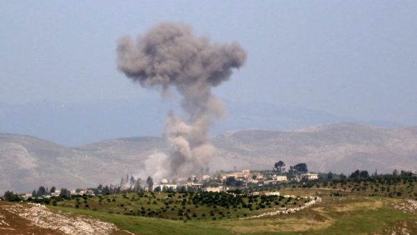 Smoke billows after reported shelling on the Syrian village of Qasabiye in the southern countryside of the jihadist-held Idlib province on May 1, 2019. (Anas AL-dyab / AFP)