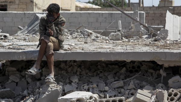 A man sits amidst the rubble of a building, destroyed during airstrikes by the Syrian regime and their allies near the town of Saraqeb in Syria's rebel-held northwestern province of Idlib on May 7, 2019. (AFP)