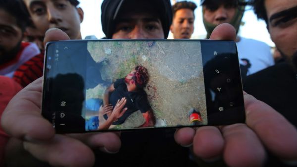 Iraqi security forces said "unidentified snipers" killed four people across the capital Baghdad today, the fourth day of violent anti-government protests. AHMAD AL-RUBAYE / AFP