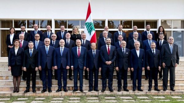 Lebanese Cabinet pose for a group photo with President Michel Aoun, first row center, Prime Minister Saad Hariri, first row center right. (AFP)