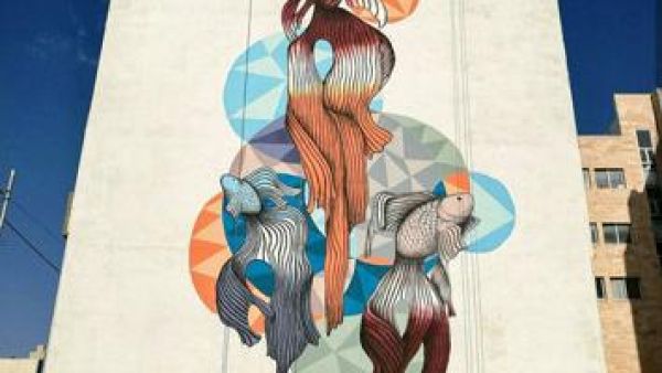 One of Yazan Mesmar’s murals in Amman can be seen. The artist says this painting of three fish was intended to make children stop and think about the artwork (Photo courtesy of Yazan Mesmar)