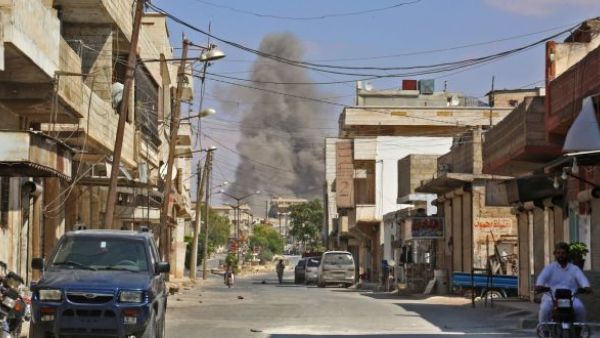 Smoke rises 4 kilometres east of Khan Shaykhun in the southern countryside of Idlib province. (Anas/AFP/Getty Images)