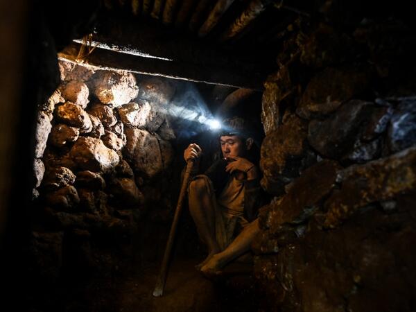 This photo taken on May 16, 2019 shows a miner working in a tunnel in a ruby mine in Mogok, north of Mandalay. Burrowing deep underground, thousands of informal miners risk their lives to find gleaming red gems as a law change spurs opportunity in Myanmar's "land of rubies". Ye Aung THU / AFP