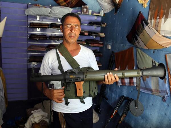Today, more than four years after the Houthi rebels began their siege on Yemen's third largest city, bullets and guns have taken over the market. AHMAD AL-BASHA / AFP