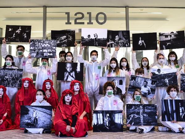 Protestors take part in a demonstration called by climate change activist group Extinction Rebellion, outside the building where the Bayer-Monsanto office is located in Buenos Aires on October 7, 2019. The year-old group Extinction Rebellion has energised a global movement demanding governments drastically cut the carbon emissions that scientists have shown to cause devastating climate change. RONALDO SCHEMIDT / AFP