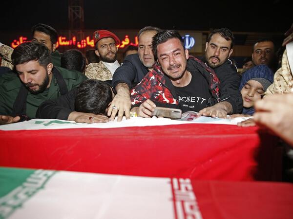 People mourn as they carry the casket of Iranian commander Qasem Soleimani upon arrival at Ahvaz International Airport in Tehran on January 5, 2020. A tide of mourners packed the streets of the Iranian city of Ahvaz Sunday to pay respects to top general Qasem Soleimani, days after he was killed in a US strike. HOSSEIN MERSADI / fars news / AFP