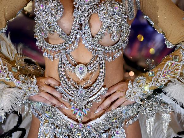 A participant prepares backstage before presenting her outfit during the Queen of the Carnival pageant contest in Santa Cruz de Tenerife, on the Spanish Canary island of Tenerife, on February 19, 2020. Gabriel BOUYS / AFP