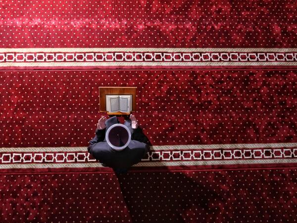 An imam attends Eid al-Fitr prayers, marking the end of the Muslim holy month of Ramadan at the Hadzi Hurem Mosque in the southern city of Novi Pazar on May 24, 2020. Muslims worldwide celebrate Eid Al-Fitr, end of daily fasting during holly month of Ramadan, as one of two most important holidays. Irfan LICINA / AFP