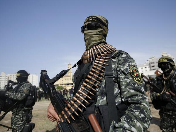 Members of the Palestinian Islamic Jihad group take part in a military parade during a condolence ceremony for the movement's former leader Ramadan Shalah in Gaza city, on June 8, 2020, two days after his death in neighbouring Lebanon. The 62-year-old was buried in Syria on June 7, a day following his death after a long illness. Mohammed ABED / AFP