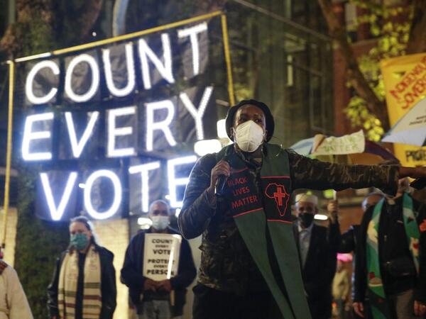 Reverend Bianca Davis-Lovelace of the Washington State Poor People's Campaign speaks at a rally and march to "Count Every Vote, Protect Every Person" a day after the US Presidential Election in Seattle, Washington on November 4, 2020. Democratic presidential challenger Joe Biden on November 4 neared the magic number of 270 electoral votes needed to win the White House with several battleground states still in play, as incumbent President Donald Trump challenged the vote count. Jason Redmond / AFP