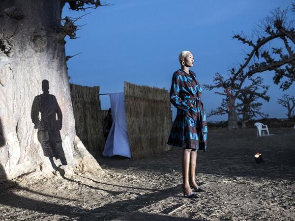 A fashion model poses at the start of the runway during Dakar Fashion Week in Dakar on December 12, 2020. JOHN WESSELS / AFP