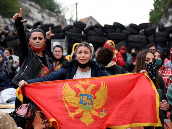 Demonstrators gather at a barricade set up to block access roads to the historic city of Cetinje during a protest against the inauguration of the new head of the Serbian Orthodox Church on September 5, 2021 in Montenegro. 