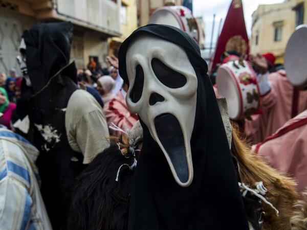 Young Moroccans take part in the Boujloud festival, a popular festival also known as the 'Moroccan Halloween' in the Sidi Moussa district of Sale near Rabat, on October 27, 2018. 
FADEL SENNA / AFP