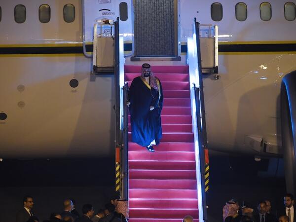 Saudi Crown Prince Mohammed Bin Salman looks on as he descends the plane upon arriving at the airport in New Delhi 
Money SHARMA / AFP