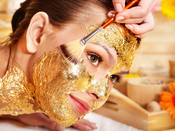 Woman getting gold facial mask (Shutterstock/File Photo)