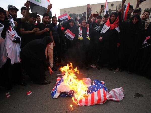 Iraqi protestors burn a US flag during a demonstration in Baghdad on April 15, 2018, opposing the joint Western air strikes against Syria's regime. The United States, Britain and France took military action in response to an alleged chemical attack in the rebel-held town of Douma a week ago that killed at least 40 people. Iraq warned that Western air strikes on Syria is a "very dangerous" development that could fuel a jihadist resurgence in the region
Ahmad al-Rubaye / AFP