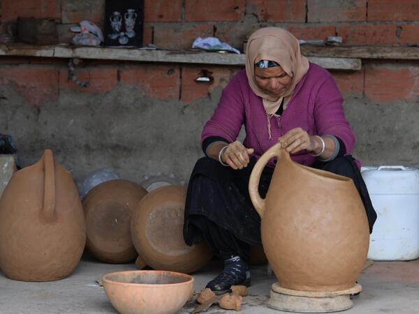 Sabiha Ayari, a Tunisian potter in her fifties, works in the village of Sejnane in the northern Tunisian province of Bizerte, about 120 kilometres (75 miles) west of the capital Tunis.  FETHI BELAID / AFP
