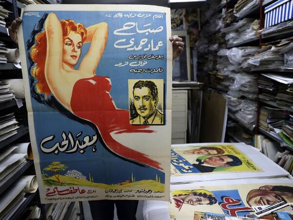 Abboudi Abu Jawdeh shows part of his vintage cinema poster collection at his office in the Lebanese capital Beirut 2019.  JOSEPH EID / AFP