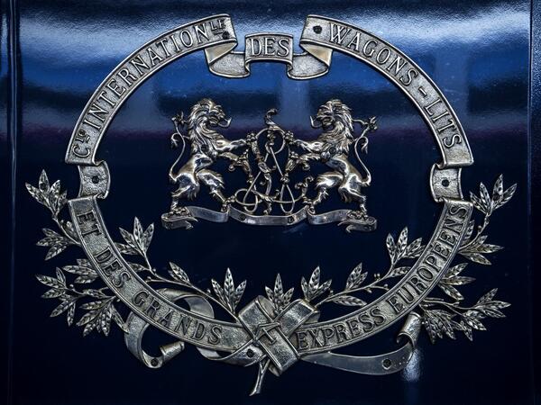 This picture taken on May 13, 2019 shows a blazon on a carriage of a restored Orient Express train displayed at the Gare de l'Est train station in Paris.  Christophe ARCHAMBAULT / AFP