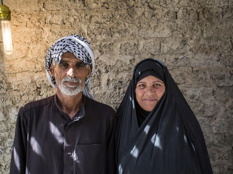 Abu Hayder, an Iraqi ecotourism guide, poses for a picture with his wife in the southern district of Chibayish in Dhi Qar province, about 120 kilometres northwest of the southern city of Basra, on March 29, 2019. Hussein FALEH / AFP