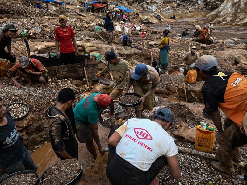 This photo taken on May 16, 2019 shows miners working in a ruby mine in Mogok, north of Mandalay. Burrowing deep underground, thousands of informal miners risk their lives to find gleaming red gems as a law change spurs opportunity in Myanmar's "land of rubies". Ye Aung THU / AFP
