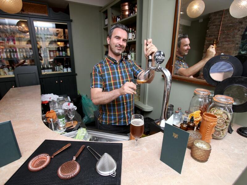 Pub co-owner Oisin Davis poses at the Virgin Mary pub, which opened recently selling non-alcoholic drinks and is known as the 'pub with no beer', in the city centre of Dublin on May 16, 2019. PAUL FAITH / AFP