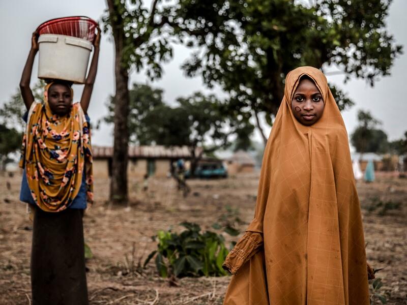 A Fulani girl stands poses for a portrait while attending to the market at Kachia Grazing Reserve, Kaduna State, Nigeria, on April 18, 2019. Luis TATO / AFP