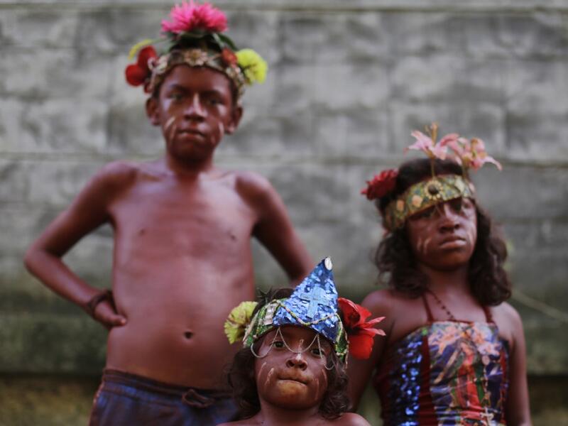 Catholic faithful children smeared in floor painture take part in the opening of the ten-day celebration of the Santo Domingo de Guzman festival in Managua, on August 1, 2019.  INTI OCON / AFP