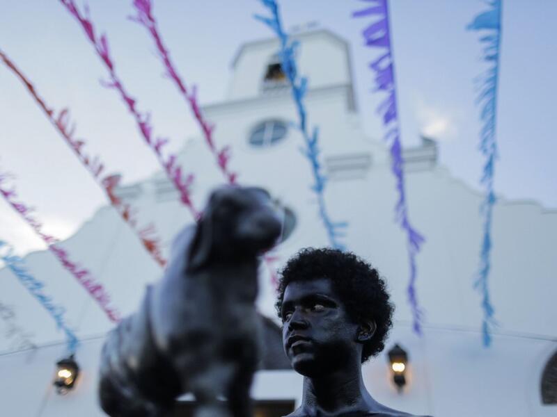 A catholic faithful smeared in burnt oil, takes part in the opening of the ten-day celebration of the Santo Domingo de Guzman festival in Managua, on August 1, 2019.  INTI OCON / AFP