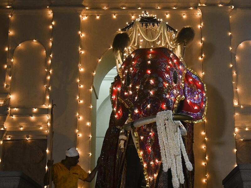 The Temple of the Tooth, Buddhism's holiest shrine on the island, holds the annual festival with traditional drummers and dancers as well as nearly 100 tamed elephants. Lakruwan WANNIARACHCHI / AFP