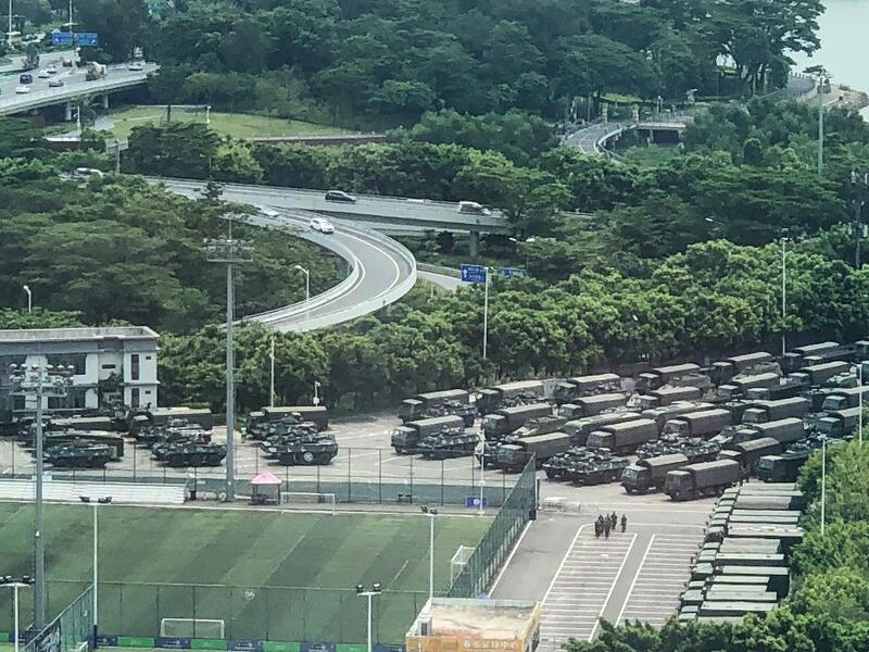 Trucks and armoured personnel carriers are seen outside the Shenzhen Bay stadium in Shenzhen, bordering Hong Kong in China's southern Guangdong province, on August 15, 2019. (AFP/ File Photo)