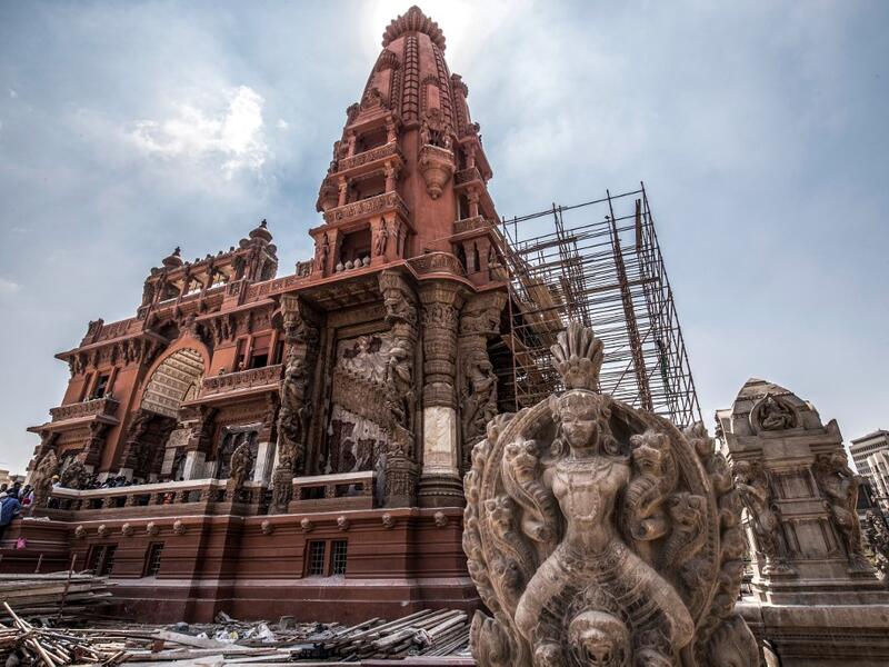 This picture taken on August 18, 2019 shows restoration works ongoing at the historic "Le Palais Hindou" (also known as the "Baron Empain Palace") built by in the early 20th century by Belgian industrialist Edouard Louis Joseph, Baron Empain, in the classical Khmer architectural style of Cambodia's Angkor Wat, in the Egyptian capital Cairo's northeastern Heliopolis district.  Khaled DESOUKI / AFP