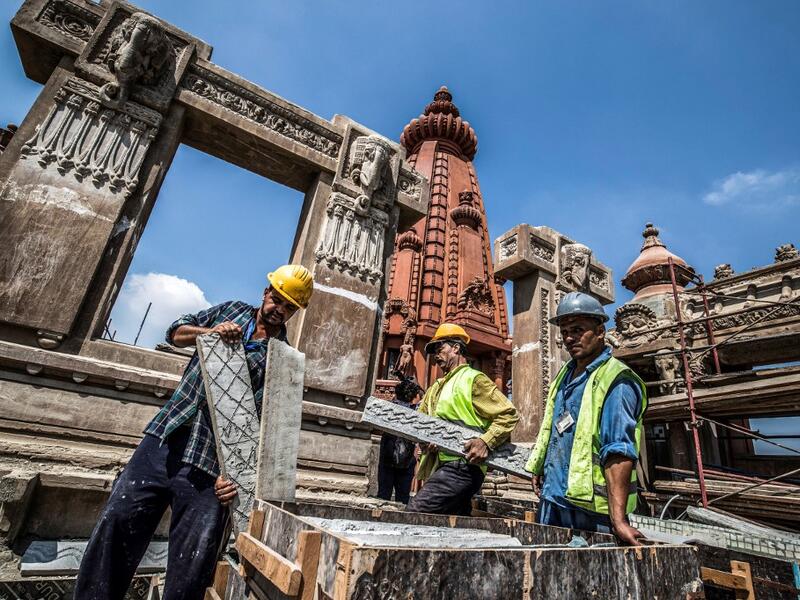 This picture taken on August 18, 2019 shows restoration works ongoing at the historic "Le Palais Hindou" (also known as the "Baron Empain Palace") built by in the early 20th century by Belgian industrialist Edouard Louis Joseph, Baron Empain, in the classical Khmer architectural style of Cambodia's Angkor Wat, in the Egyptian capital Cairo's northeastern Heliopolis district.  Khaled DESOUKI / AFP