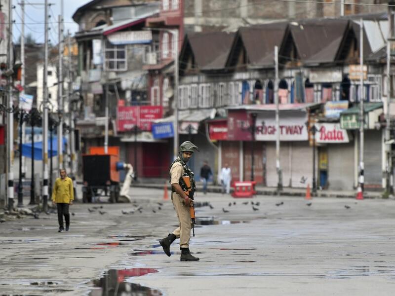 A security personnel patrols on a deserted road of the Lal Chowk area in Srinagar on August 19, 2019. (AFP/ File Photo) A security personnel patrols on a deserted road of the Lal Chowk area in Srinagar on August 19, 2019. (AFP/ File Photo)