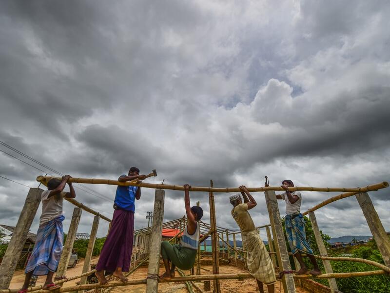 Rohingya refugees build a makeshift office at Kutupalong refugee camp in Ukhia district on August 23, 2019.  MUNIR UZ ZAMAN / AFP
