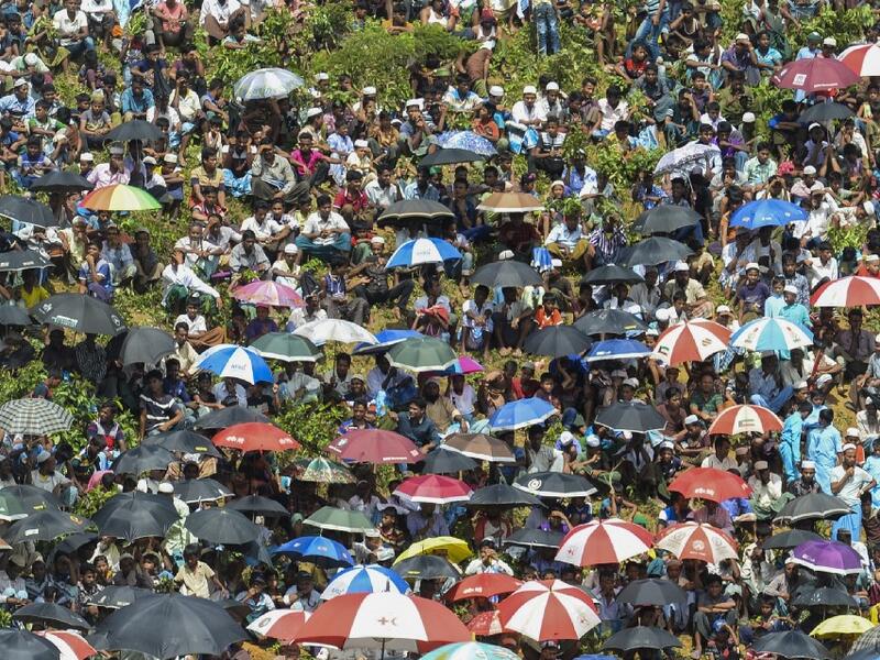 Rohingya refugees attend a ceremony organised to remember the second anniversary of a military crackdown that prompted a massive exodus of people from Myanmar to Bangladesh, at the Kutupalong refugee camp in Ukhia on August 25, 2019. MUNIR UZ ZAMAN / AFP