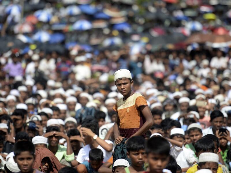 Rohingya refugees attend a ceremony organised to remember the second anniversary of a military crackdown that prompted a massive exodus of people from Myanmar to Bangladesh, at the Kutupalong refugee camp in Ukhia on August 25, 2019. MUNIR UZ ZAMAN / AFP
