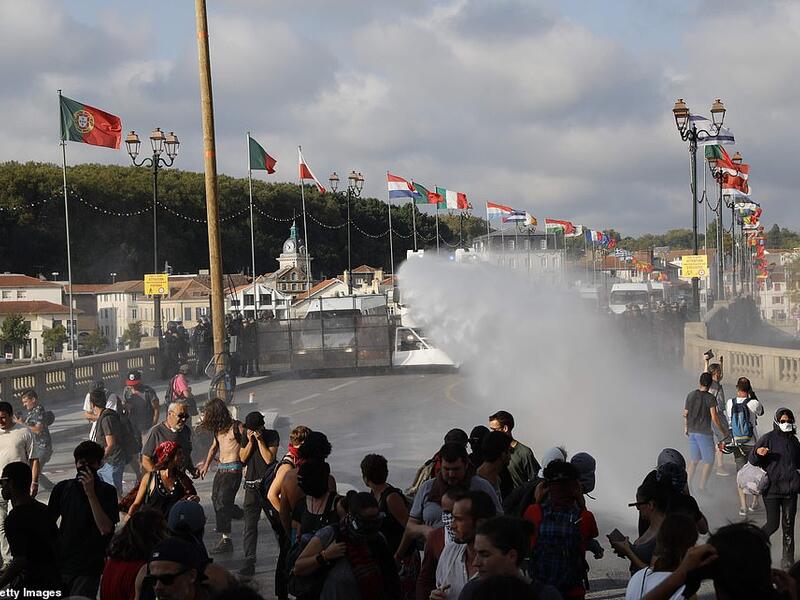 French security personnel fire a water canon during a protest in the city of Bayonne. (AFP/ File Photo)