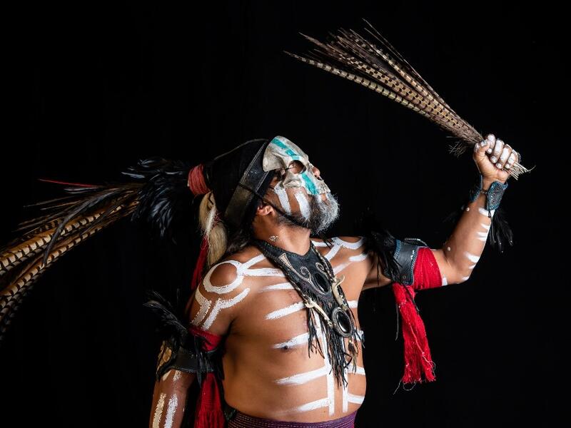 Mexican dancer Jorge de Jesus Trujillo, who represents "Mictlantecuhtli" (deity of the dead in the Mexica mythology) in a pre-Columbian ballgame called "Ulama" -in Nahuatl indigenous language-, poses for a photograph during a photo session at the FARO Poniente cultural center in Mexico City on August 21, 2019. Omar TORRES / AFP
