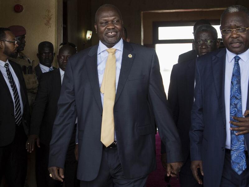 South Sudan's exiled rebel leader Riek Machar (L) arrives for a meeting with his rival, President Salva Kiir (not pictured) in Juba, South Sudan (AFP)