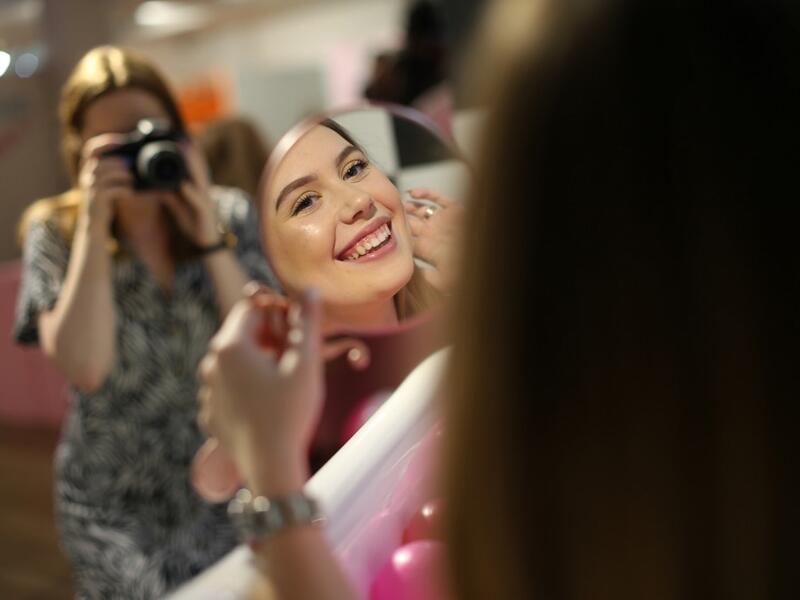 Visitors take and pose for "selfie" photographs at The Selfie Factory in Westfield London shopping centre in west London on September 11, 2019. ISABEL INFANTES / AFP