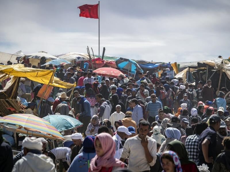Amazigh (Berber) men and women take part in the annual "Engagement Moussem" festival near the village of Imilchil in central Morocco's high Atlas Mountains on September 21, 2019. Each year in the High Atlas Mountains hamlet of Ait Amer, tribes celebrate with dances and music, the collective wedding of young Amazigh couples during the traditional festival of "Engagement Moussem". FADEL SENNA / AFP