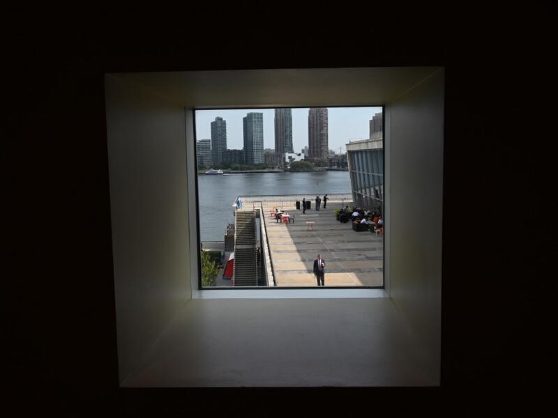 People take a break on the patio during the 74th Session of the General Assembly during the United Nations General Assembly September 26, 2019 in New York. TIMOTHY A. CLARY / AFP