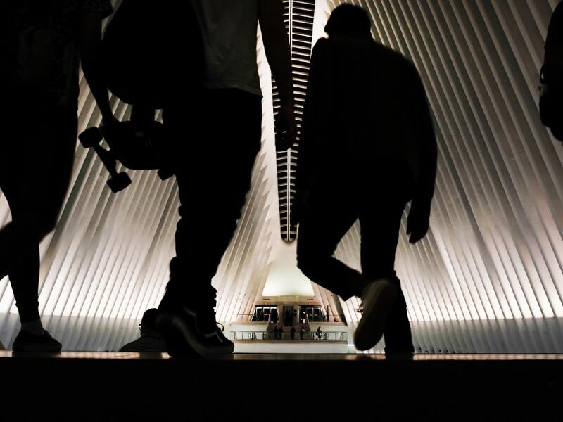 People enter the Oculus, the sculpture that tops the World Trade Center Transportation Hub, in New York City. New York City is preparing to commemorate the 18th anniversary of the attacks on the World Trade Center in which 2,996 people were killed and over 6000 were injured. Spencer Platt/Getty Images/AFP SPENCER PLATT / GETTY IMAGES NORTH AMERICA / AFP