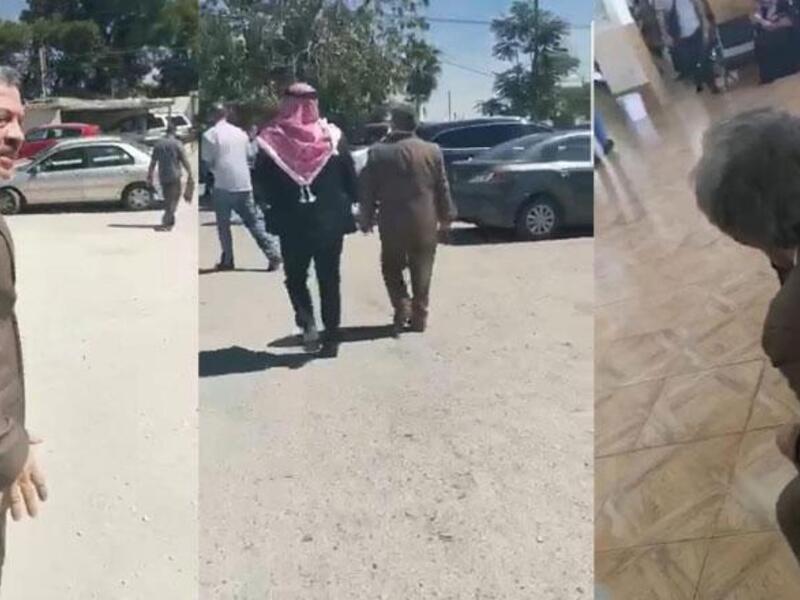 King Abdullah is seen walking in the parking lot of the north Amman Department of Land and Survey during an undercover visit recently (jordantimes)