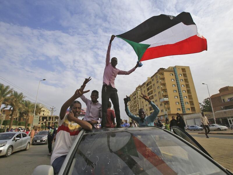 Sudanese protesters wave their national flag during a demonstration called for by the Sudanese Professionals Association (SPA) to denounce the July 29 Al-Obeid killings, in the capital Khartoum on August 1, 2019. (AFP/ File Photo) Sudanese protesters wave their national flag during a demonstration called for by the Sudanese Professionals Association (SPA) to denounce the July 29 Al-Obeid killings, in the capital Khartoum on August 1, 2019. (AFP/ File Photo)