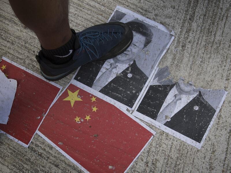 Strife-torn Hong Kong on October 1 marked the 70th anniversary of communist China's founding with defiant "Day of Grief" protests and fresh clashes with police as pro-democracy activists ignored a ban and took to the streets across the city. Mark RALSTON / AFP