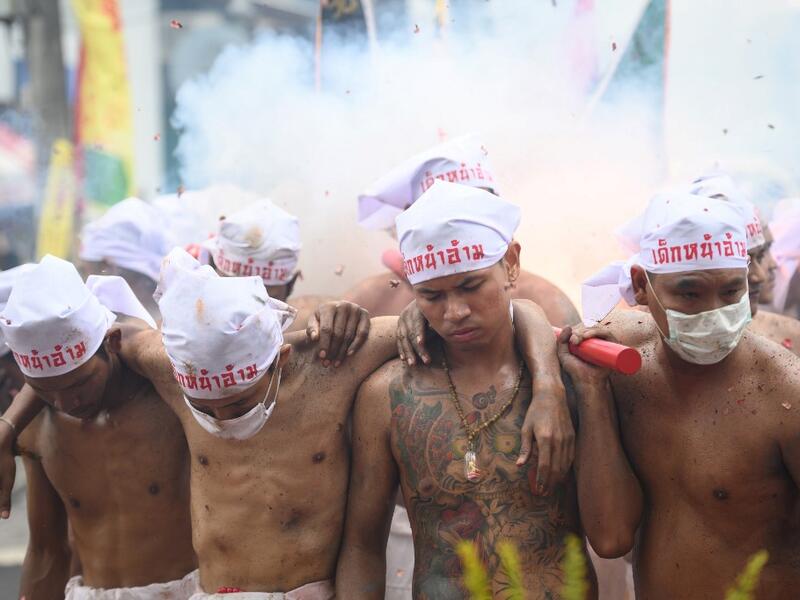The festival begins on the first evening of the ninth lunar month and lasts for nine days, with many religious devotees slashing themselves with swords, piercing their cheeks with sharp objects and committing other painful acts to purify themselves, taking on the sins of the community. Mladen ANTONOV / AFP
